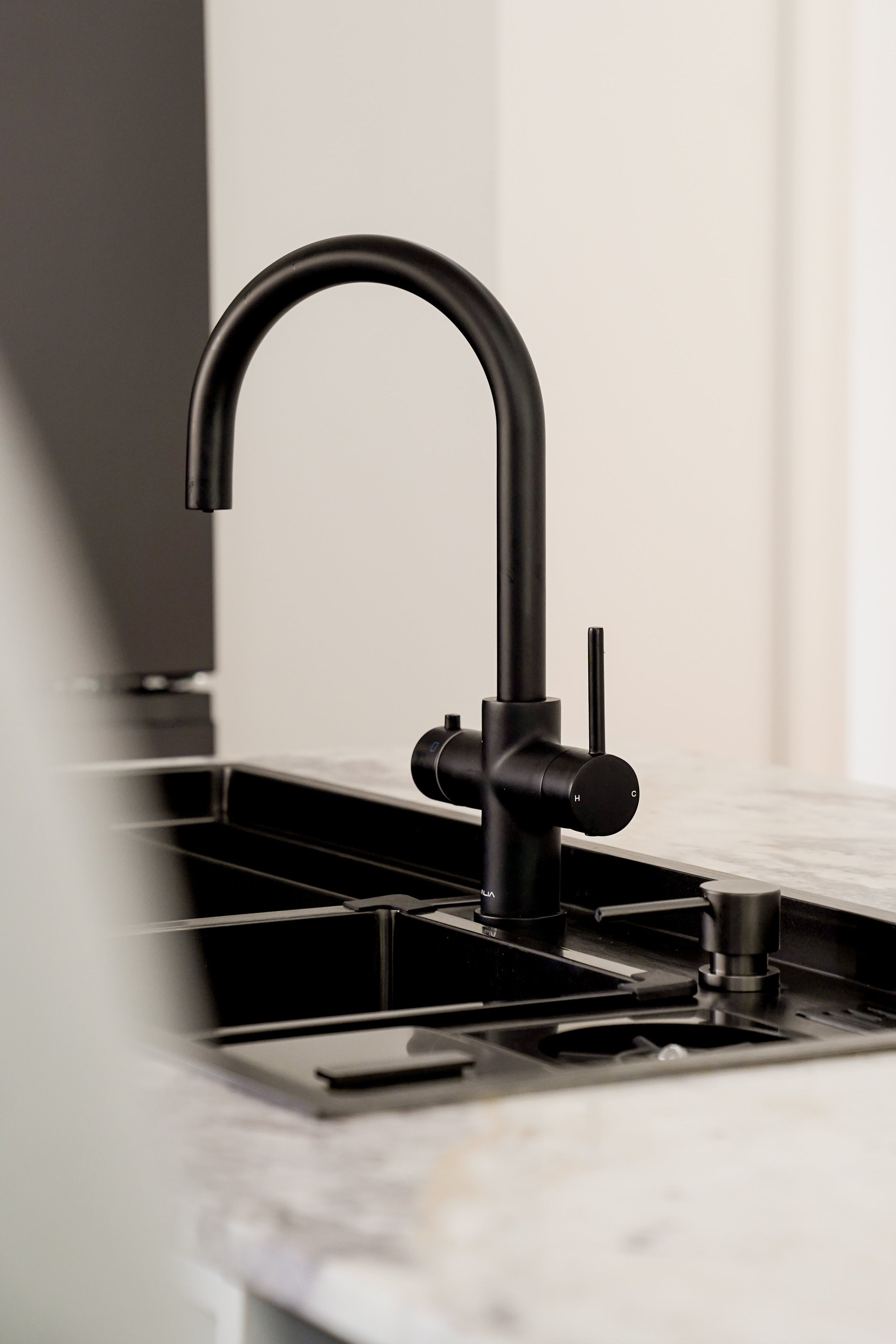 Alia products combined, smart sink with 4-in-1 water dispenser in a sleek stainless steel finish, featuring multifunctional tapware for modern kitchens. Perfect for those seeking a smart sink and all-in-one kitchen water dispenser solution.