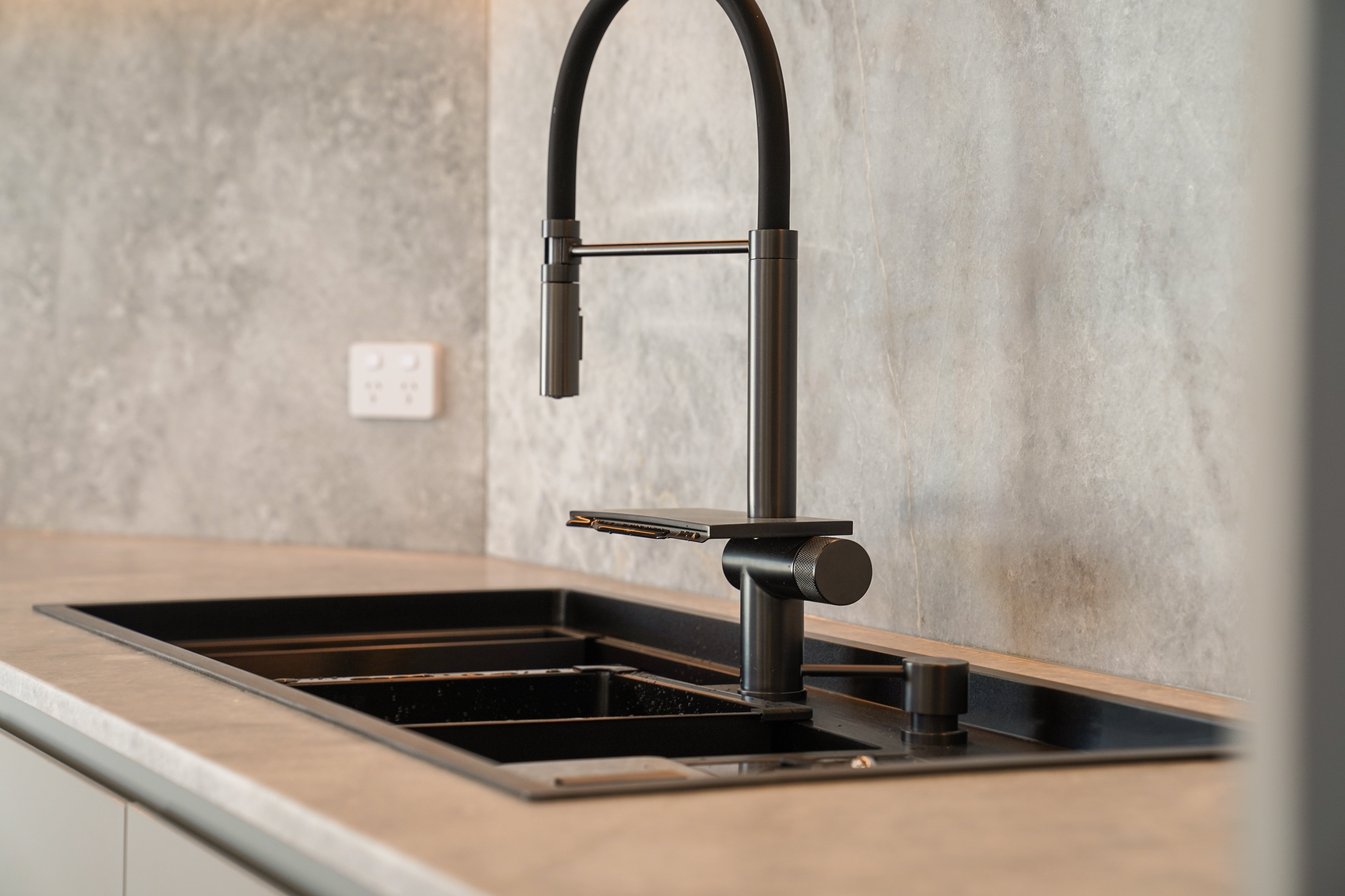 Stainless steel Alia Smart Sink displayed in a modern kitchen setting, featuring innovative design for efficient kitchen water management.