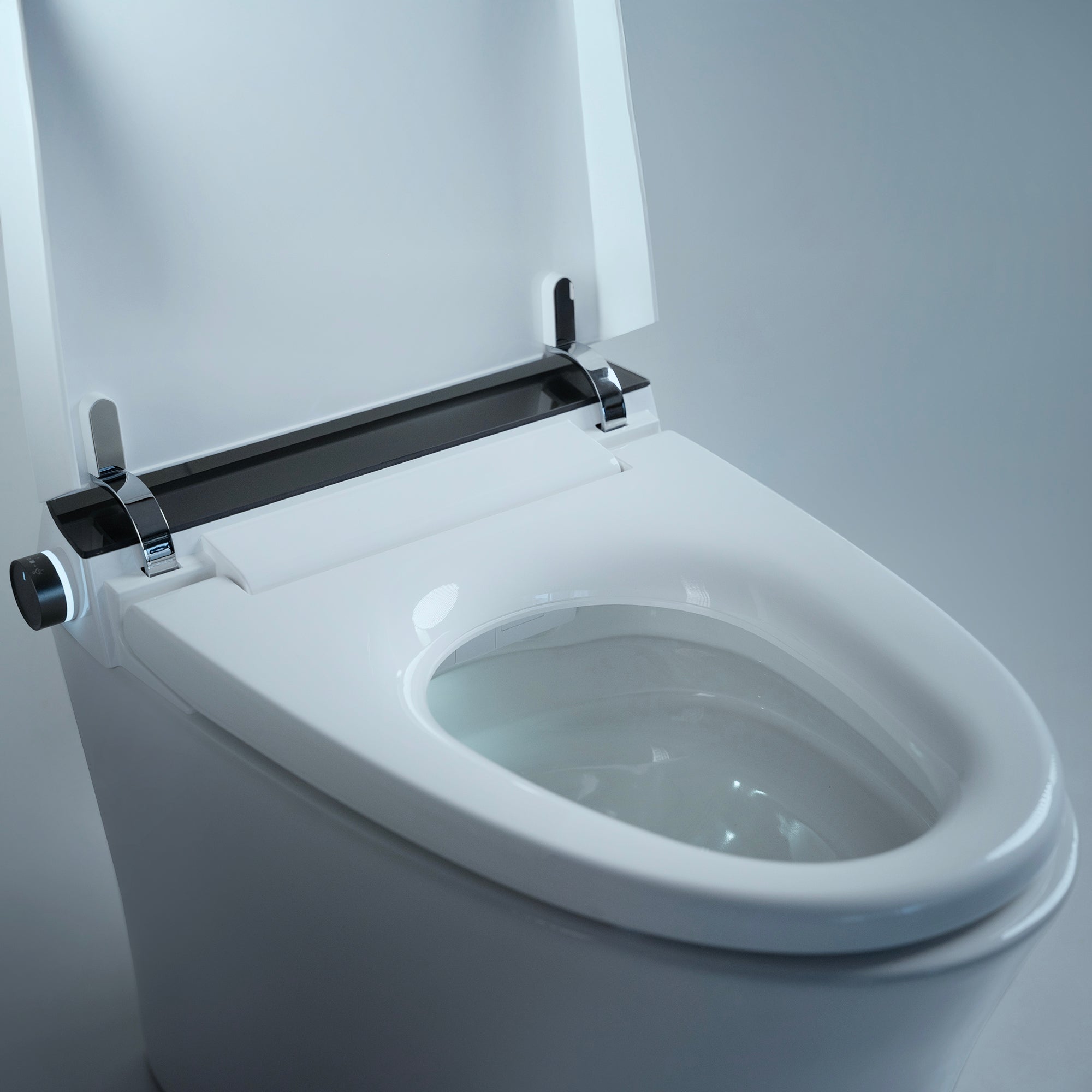 Close-up of Alia integrated bidet smart toilet in white, displaying nozzle, control panel, and soft-close seat for ultimate convenience and bathroom hygiene.