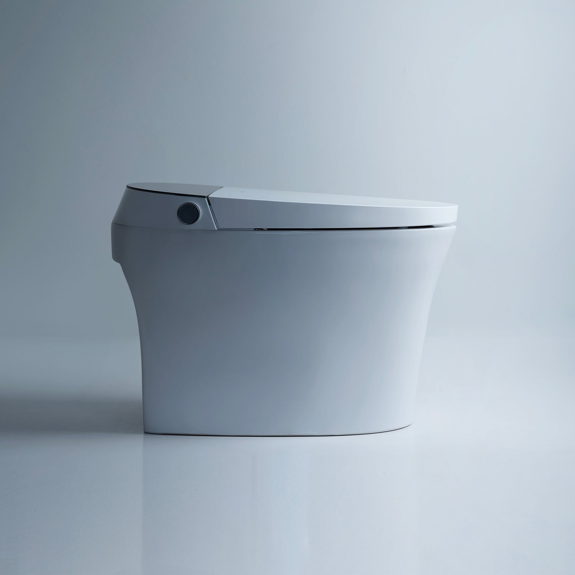 Side view of the Alia Smart Toilet with integrated bidet in white, showcasing sleek profile and seamless bidet nozzle, designed for elegant, hygienic bathroom environments.