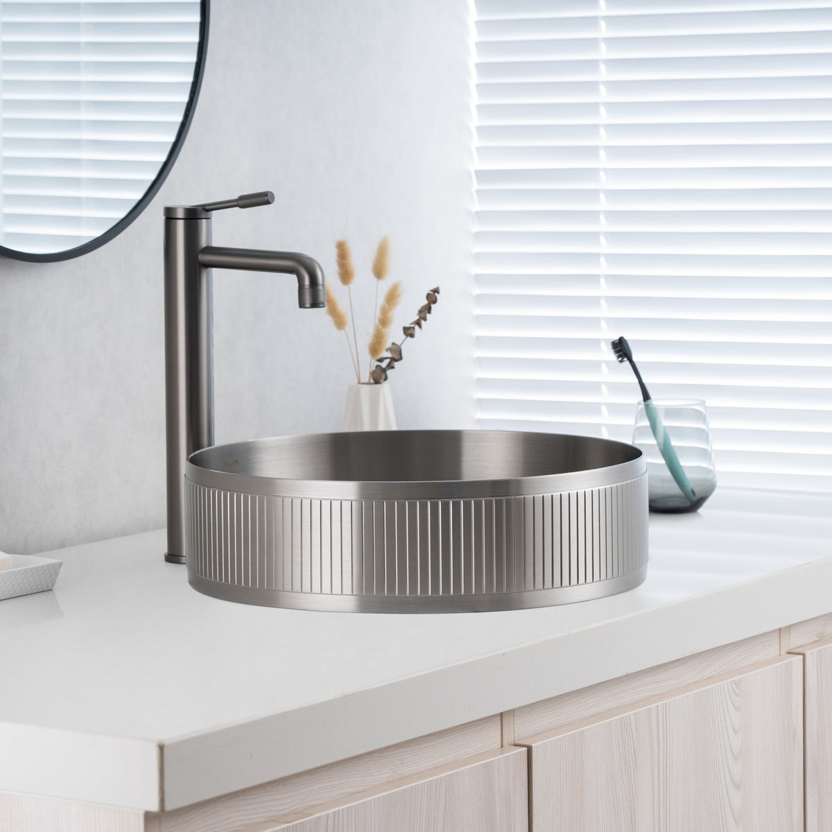 Close-up of installed ALIA textured brushed silver sink highlighting its brushed texture and soft reflective finish.