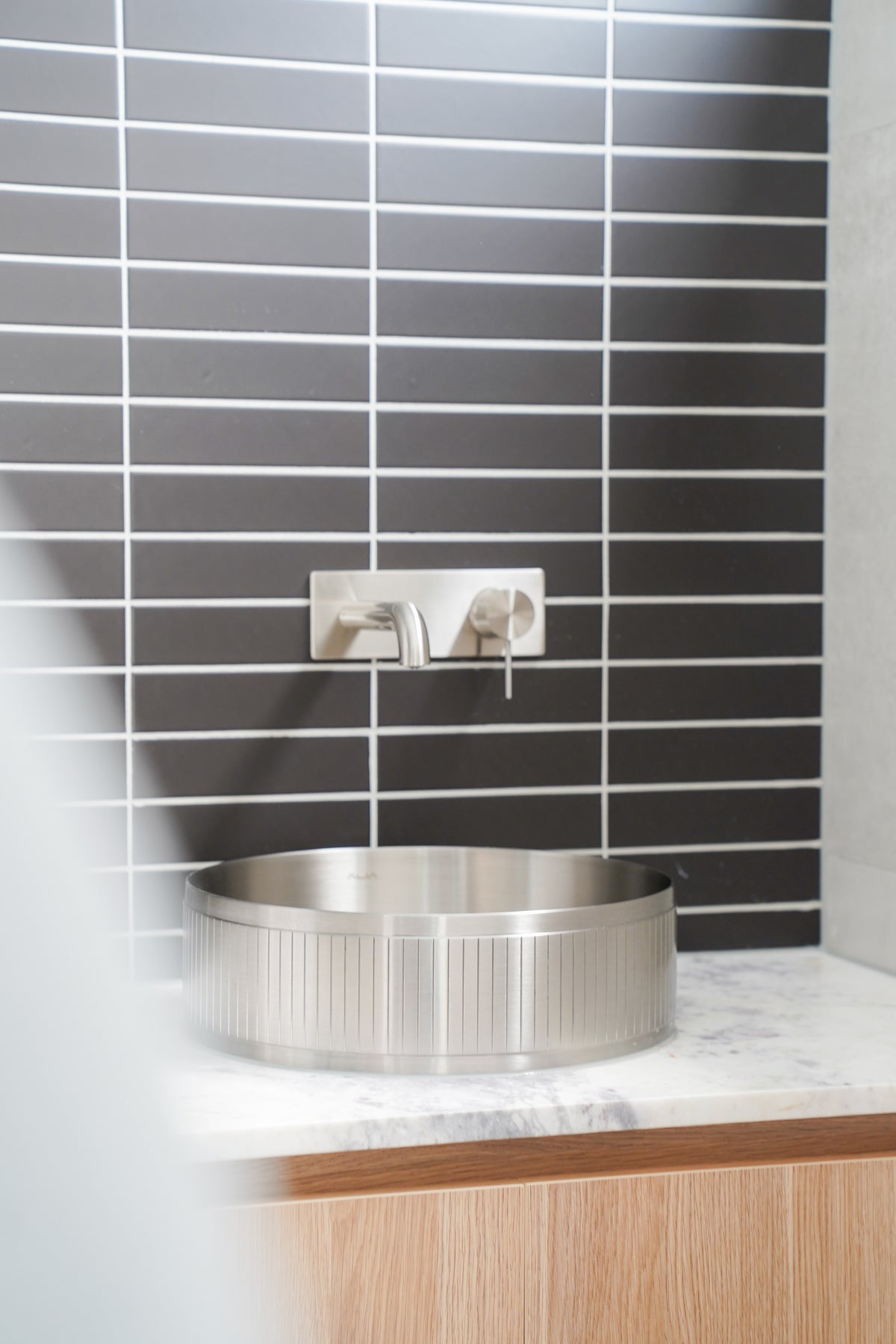 Alia stainless steel designer basin on a bathroom vanity