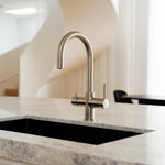 Brushed nickel Alia Global 4-in-1 instant hot filtered water tap installed in a modern kitchen, highlighting a stylish filtered and instant boiling water dispenser ideal for home or office.
