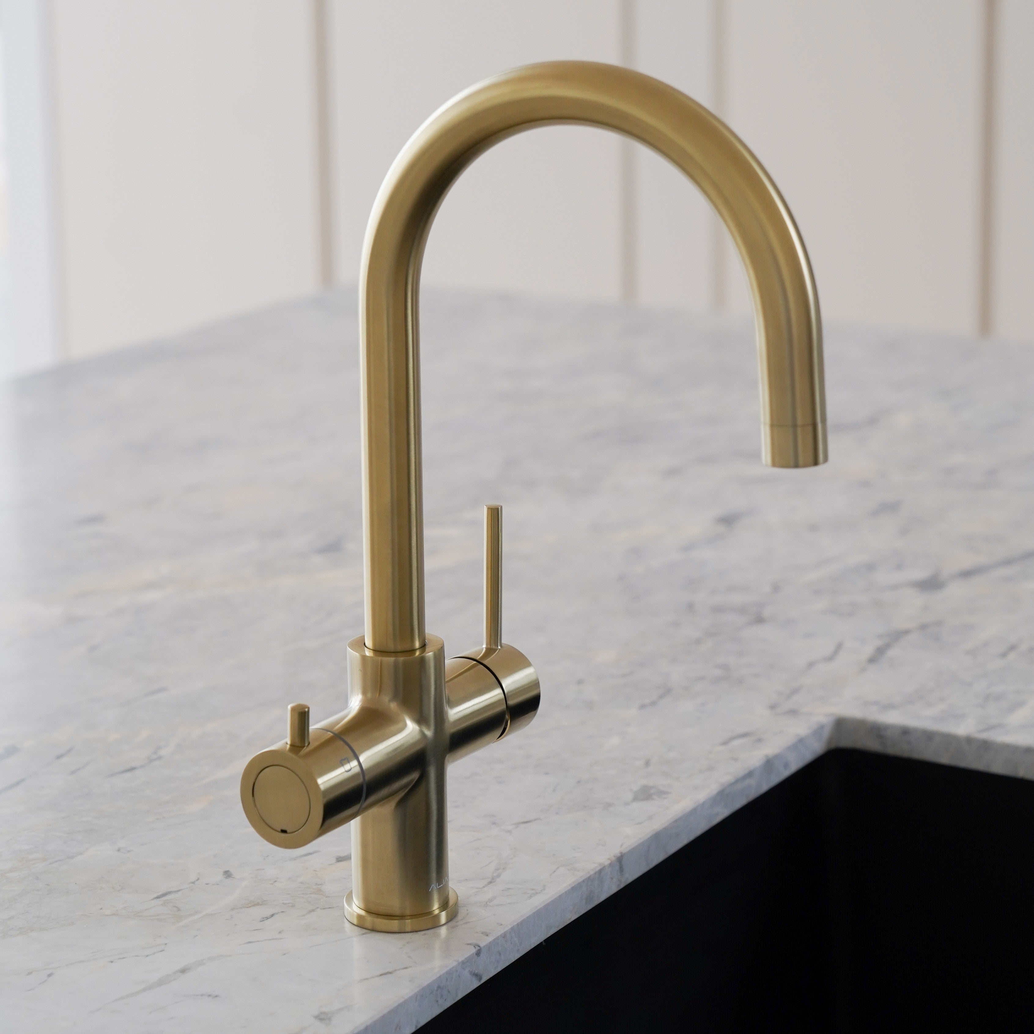 aliaglobal-com-au brushed gold 4-in-1 instant hot and cold filtered water tap installed in a modern kitchen, showcasing elegant design and advanced tap technology for home use.