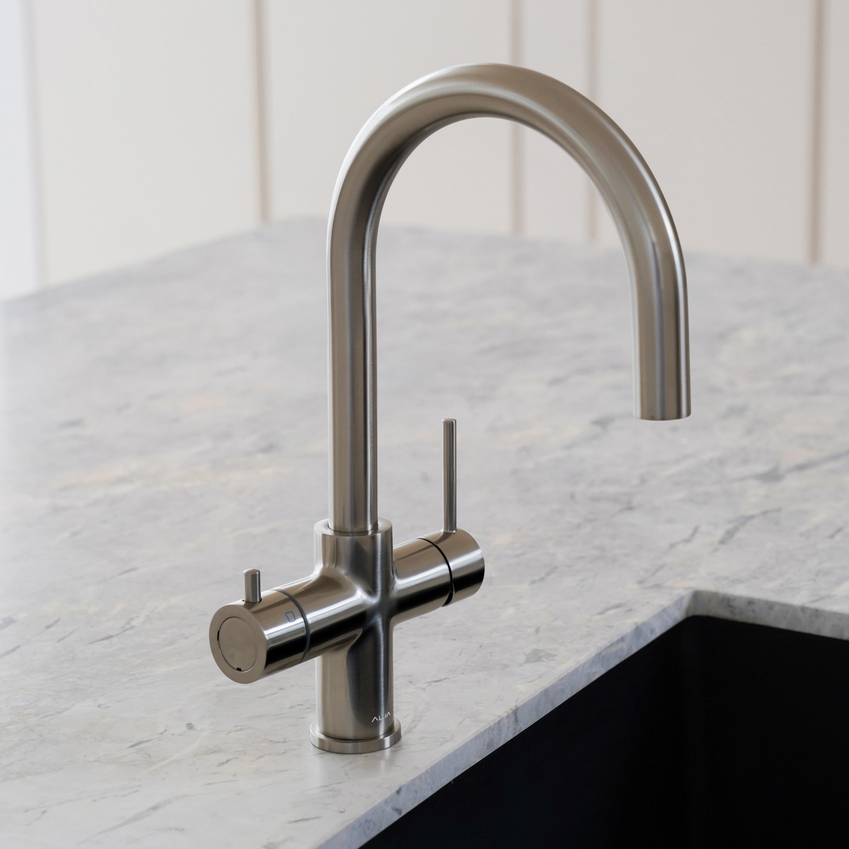 aliaglobal-com-au brushed gold 4-in-1 instant hot and cold filtered water tap installed in a modern kitchen, showcasing elegant design and advanced tap technology for home use.