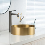 Close-up of installed ALIA brushed gold bathroom sink showcasing its reflective surface, smooth curves, and luxurious modern appeal.