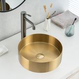 Real image of ALIA brushed gold round stainless steel basin installed on a modern vanity, highlighting its elegant metallic finish and above-counter design.