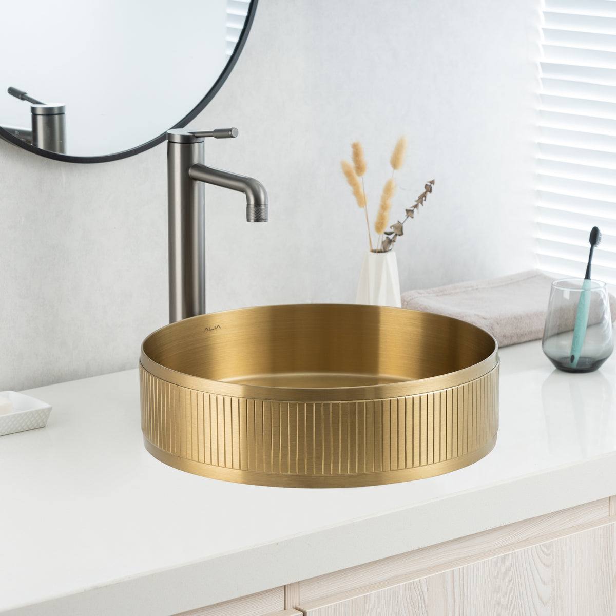 Close-up of ALIA textured brushed gold sink highlighting its brushed detailing and golden satin finish.
