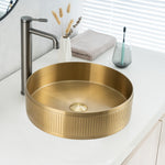 Real photo of ALIA textured brushed gold basin installed above-counter, showcasing its soft shimmer and refined grain texture.