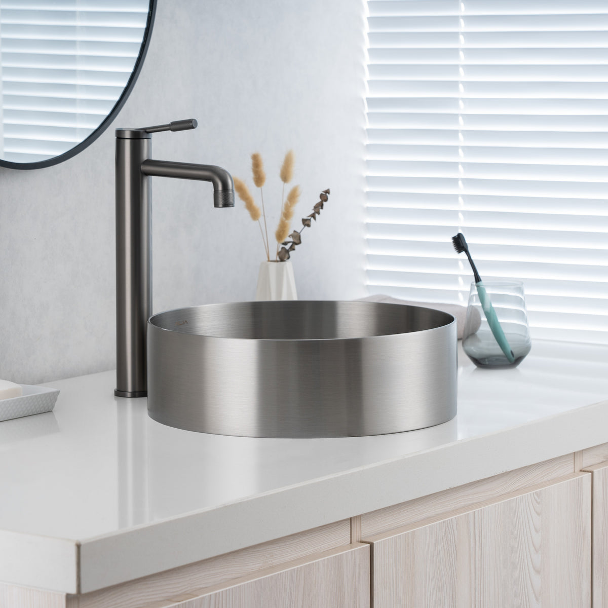 Close-up of installed ALIA brushed silver stainless steel sink showing its brushed texture and contemporary appeal.
