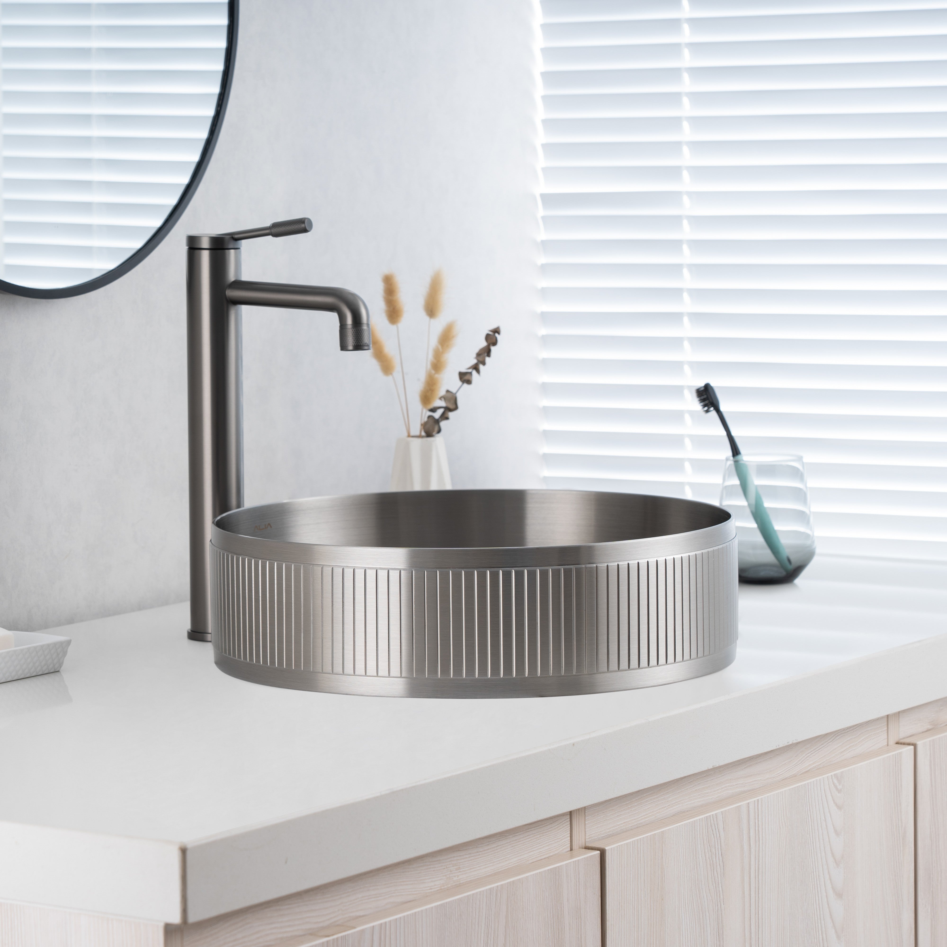 Close-up of installed ALIA textured brushed silver sink highlighting its brushed texture and soft reflective finish.