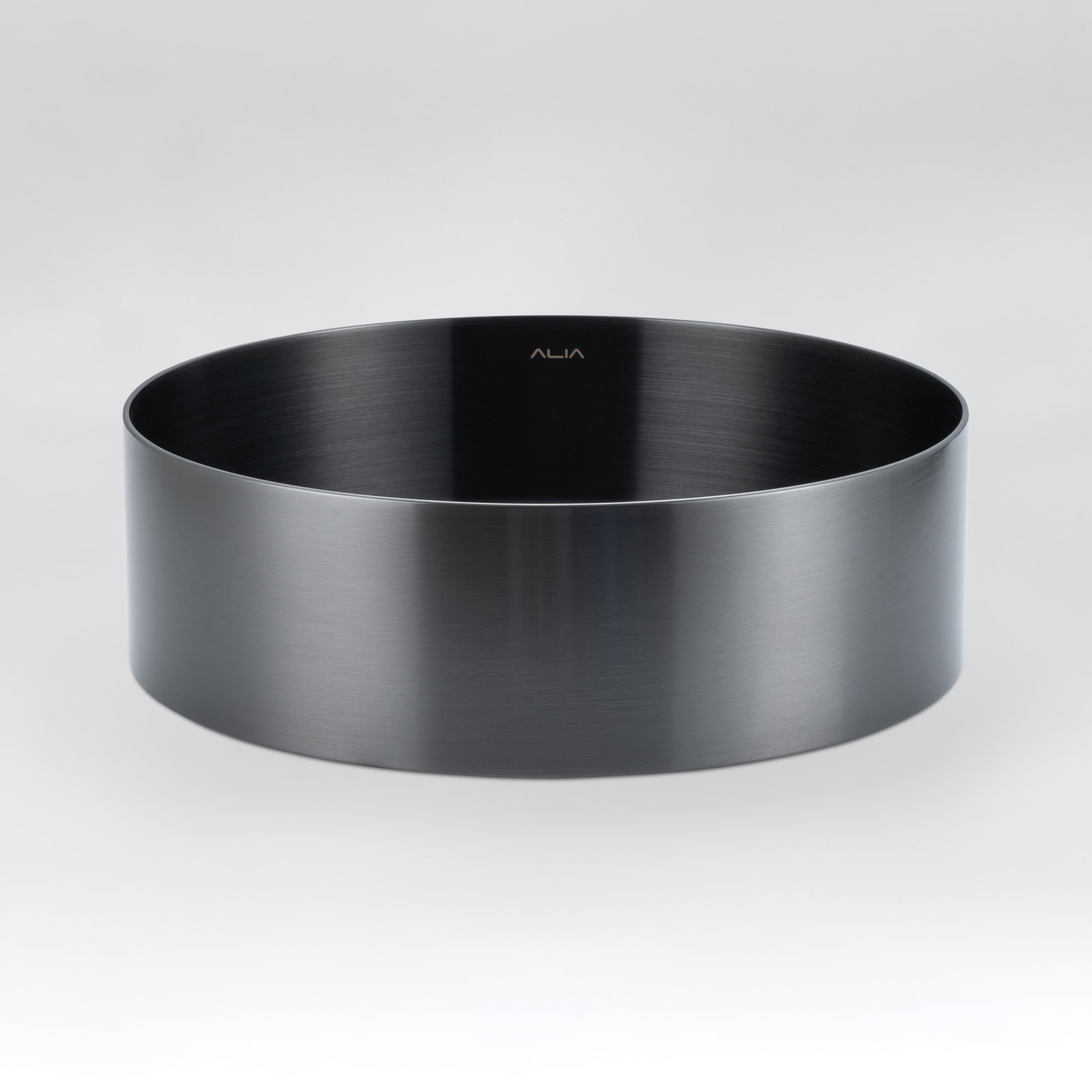 Stylish round stainless steel sink in gunmetal grey finish from ALIA, perfect for luxury bathroom spaces. Black round metal basin on a light grey background.