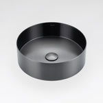 Gunmetal grey round stainless steel basin by ALIA designed for elegant, minimalist bathroom interiors. Black round sink on a light gray background.