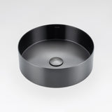 Gunmetal grey round stainless steel basin by ALIA designed for elegant, minimalist bathroom interiors. Black round sink on a light gray background.