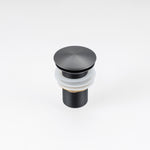 ALIA gunmetal grey pop-up waste drain for stainless steel bathroom basins, designed for seamless functionality and modern aesthetics.