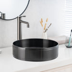 Close-up of installed ALIA textured gunmetal grey sink highlighting its tactile finish and sleek round contours.