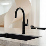 Alia X51 instant hot, cold, and sparkling filtered water tap in matte black accenting a luxury kitchen, highlighting its premium filtered water and bold contemporary design.
