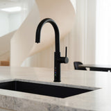 Alia X51 instant hot, cold, and sparkling filtered water tap in matte black accenting a luxury kitchen, highlighting its premium filtered water and bold contemporary design.